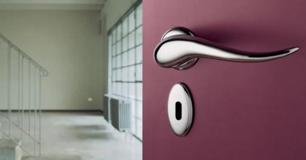 A close-up of a 6 inches long door handle mounted on a vibrant purple wall, showcasing its sleek design and color contrast.