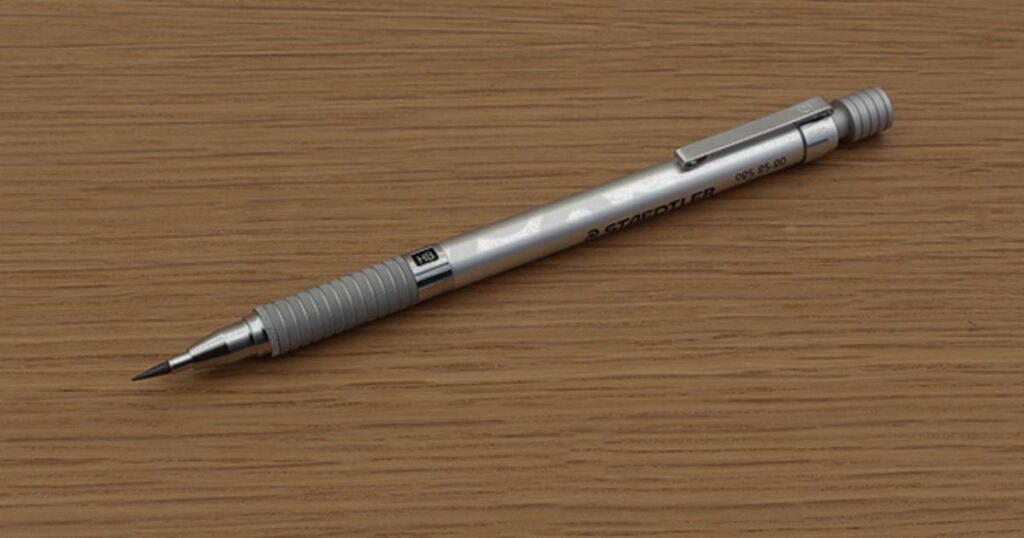 A pen with a black cap rests on a table, highlighting the precision of 2mm Standard Pencil Lead.